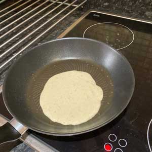 pan with pancake mixture in centre